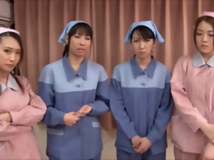 Morose Asian nurses milking a hard flannel together